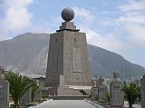 Ecuador Quito 04-02 Mitad Del Mundo Closer View The centre of La Mitad del Mundo is a 30m stone trapezoid monument topped with a brass globe, with each side of the pyramid facing a cardinal direction.